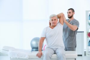 Physiotherapist,Working,With,Patient,In,Clinic